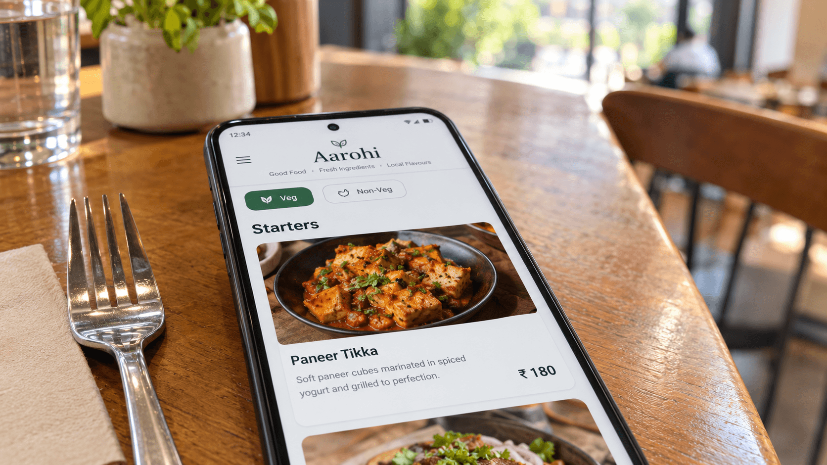 Digital QR code menu on a smartphone at a restaurant table with veg filter and prices